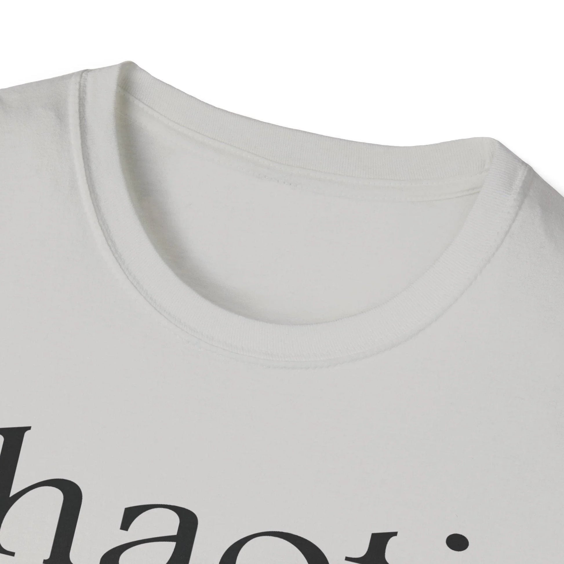 Close-up of the black unisex softstyle T-shirt's fabric texture and subtle stitching detail at the sleeve hem from a