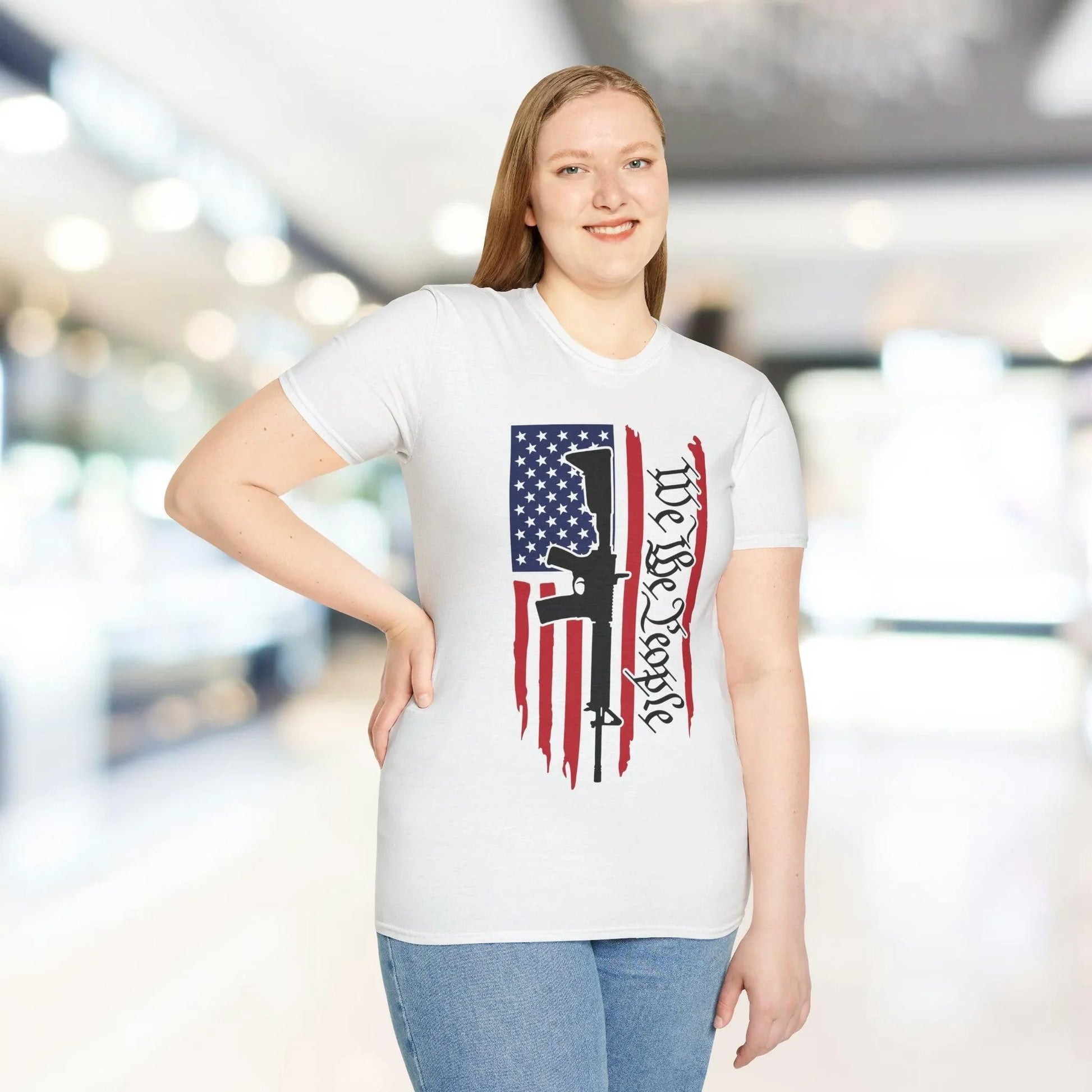 Close-up of the distressed American flag print on the front chest of the relaxed-fit, soft cotton T-shirt featuring vibrant