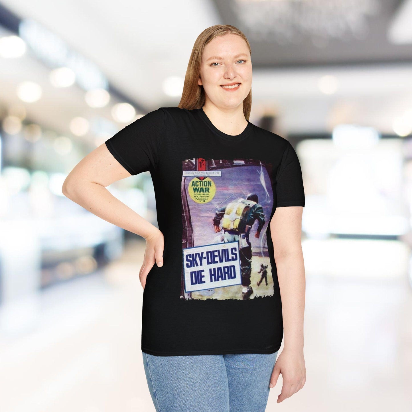 Close-up of the unisex softstyle T-shirt's vibrant red fabric showing subtle heather texture and slim fit neckline from a