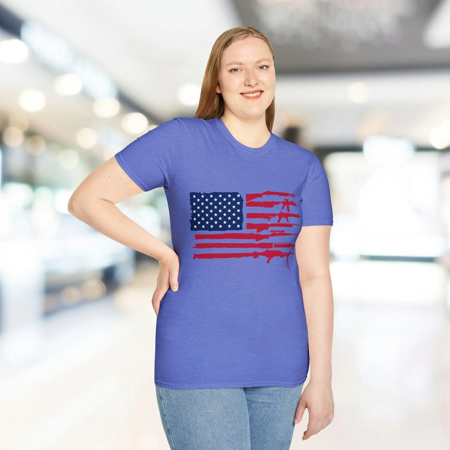 Close-up of the American flag guns graphic on the chest of the soft blue cotton T-shirt, highlighting vibrant print details