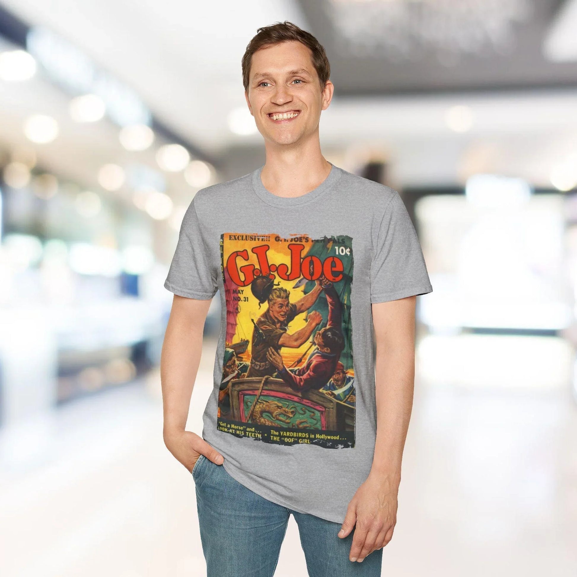 Close-up of the unisex softstyle fabric tag sewn onto the relaxed fit, heather gray G.I. Joe No.31 T-shirt highlighting