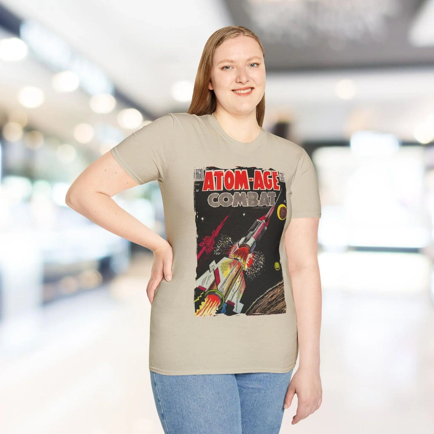 Close-up of the Atom-Age Combat No.3 T-shirt fabric showing the soft, smooth texture and vibrant burnt orange color from the