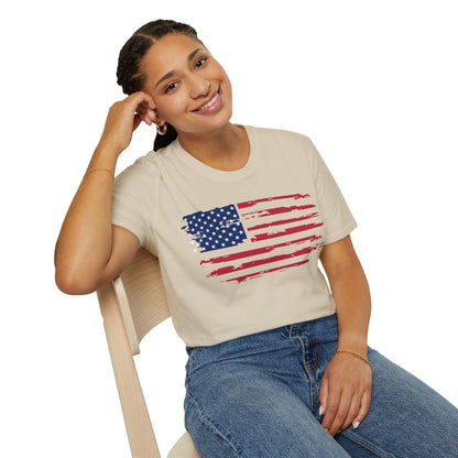 Close-up of distressed American flag design with faded colors and torn edges on the relaxed fit T-shirt fabric.