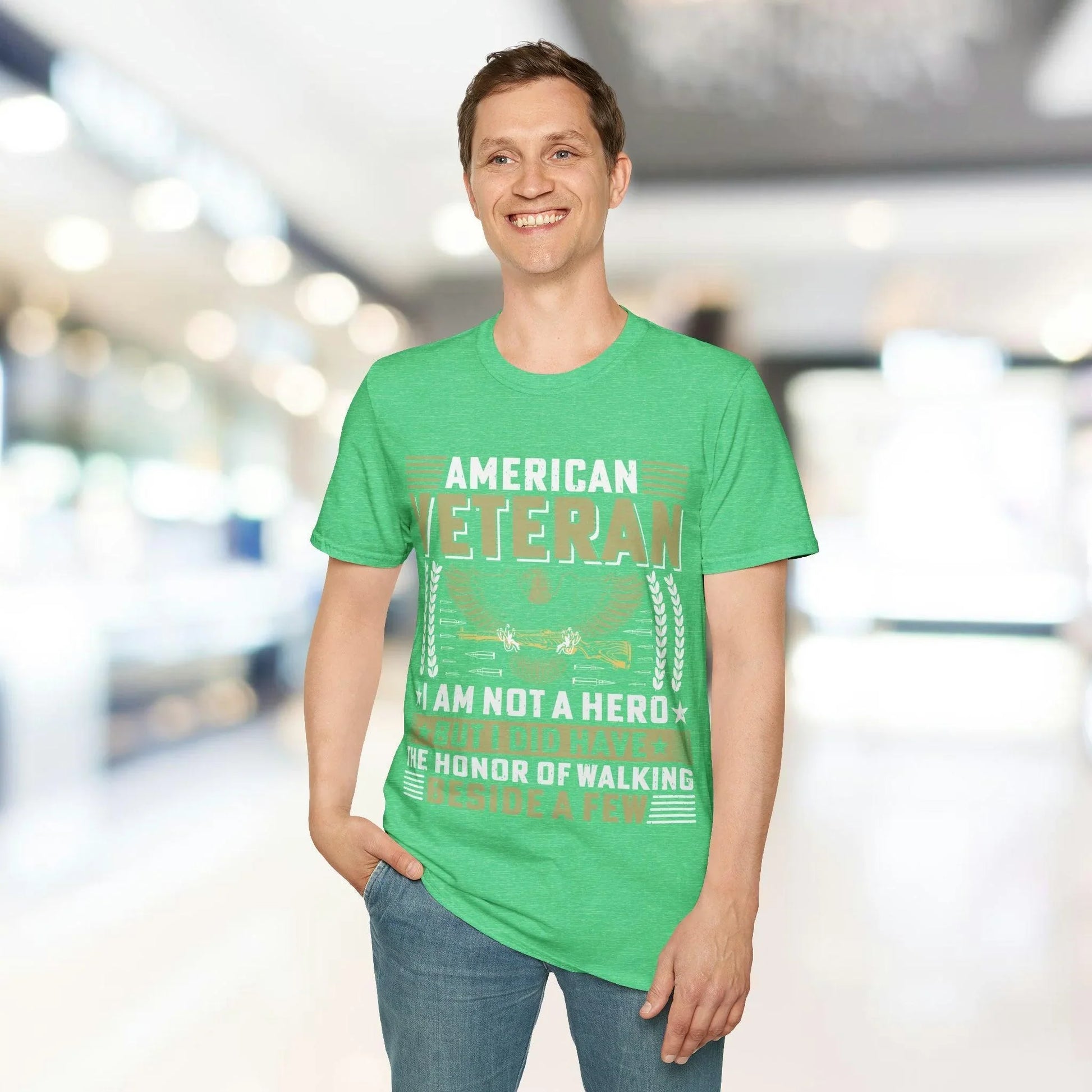 Close-up of the I AM NOT A HERO logo printed on the front chest of the heather charcoal unisex softstyle T-shirt with short