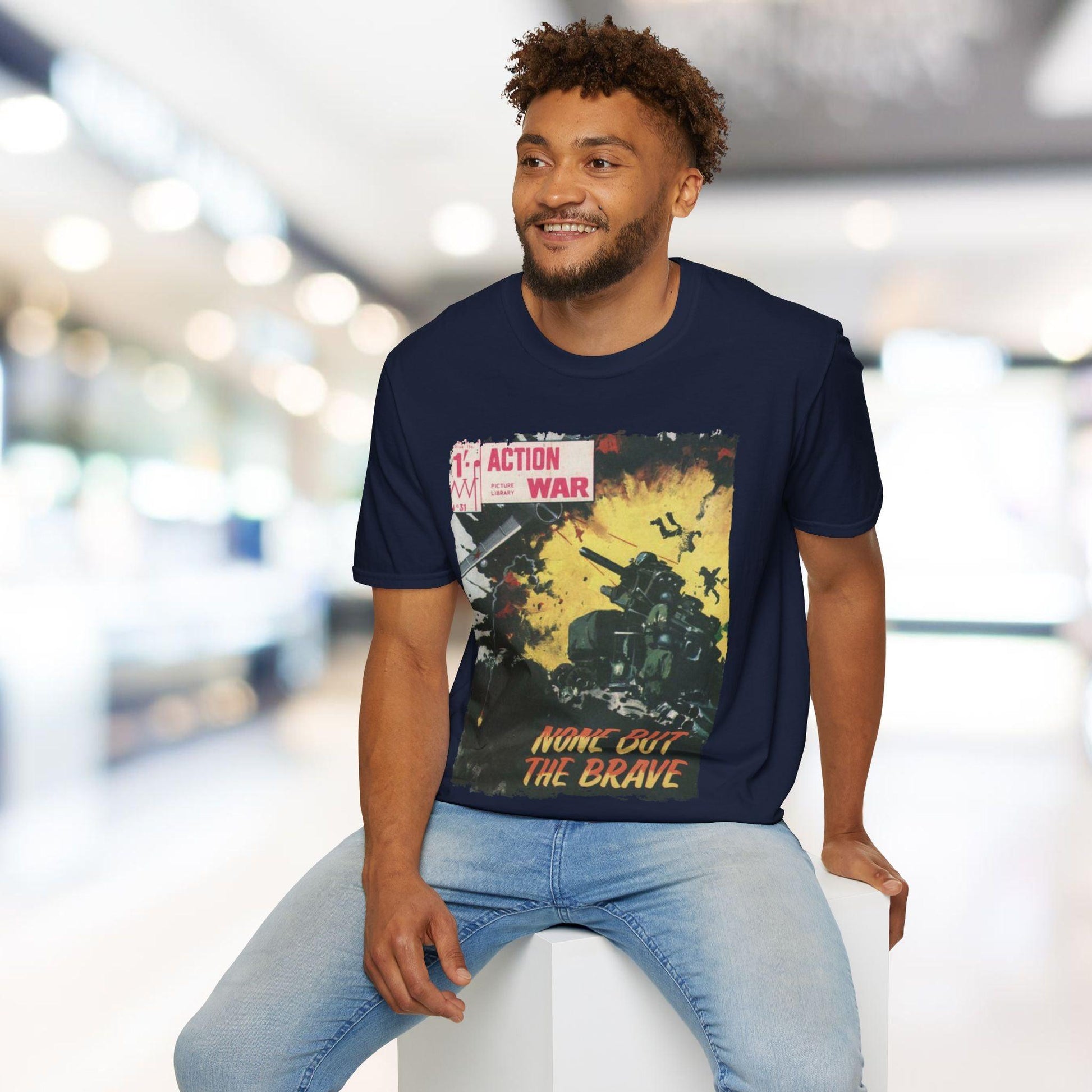 Close-up of the unisex softstyle T-shirt's relaxed fit label featuring "Action War #31" graphic on creamy beige fabric with