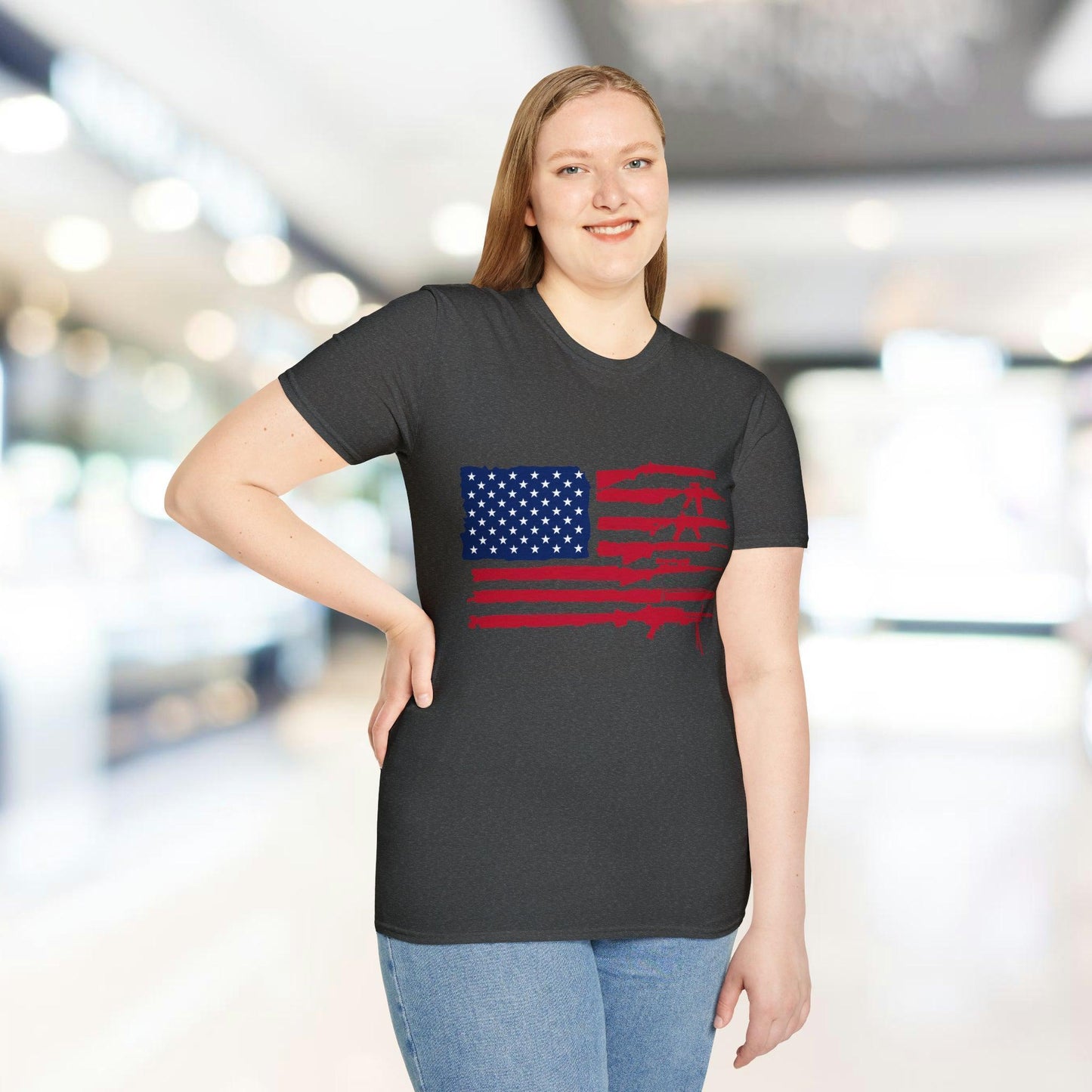 Close-up of the unisex T-shirt fabric showing American flag guns graphic with vibrant colors and a relaxed fit neckline on