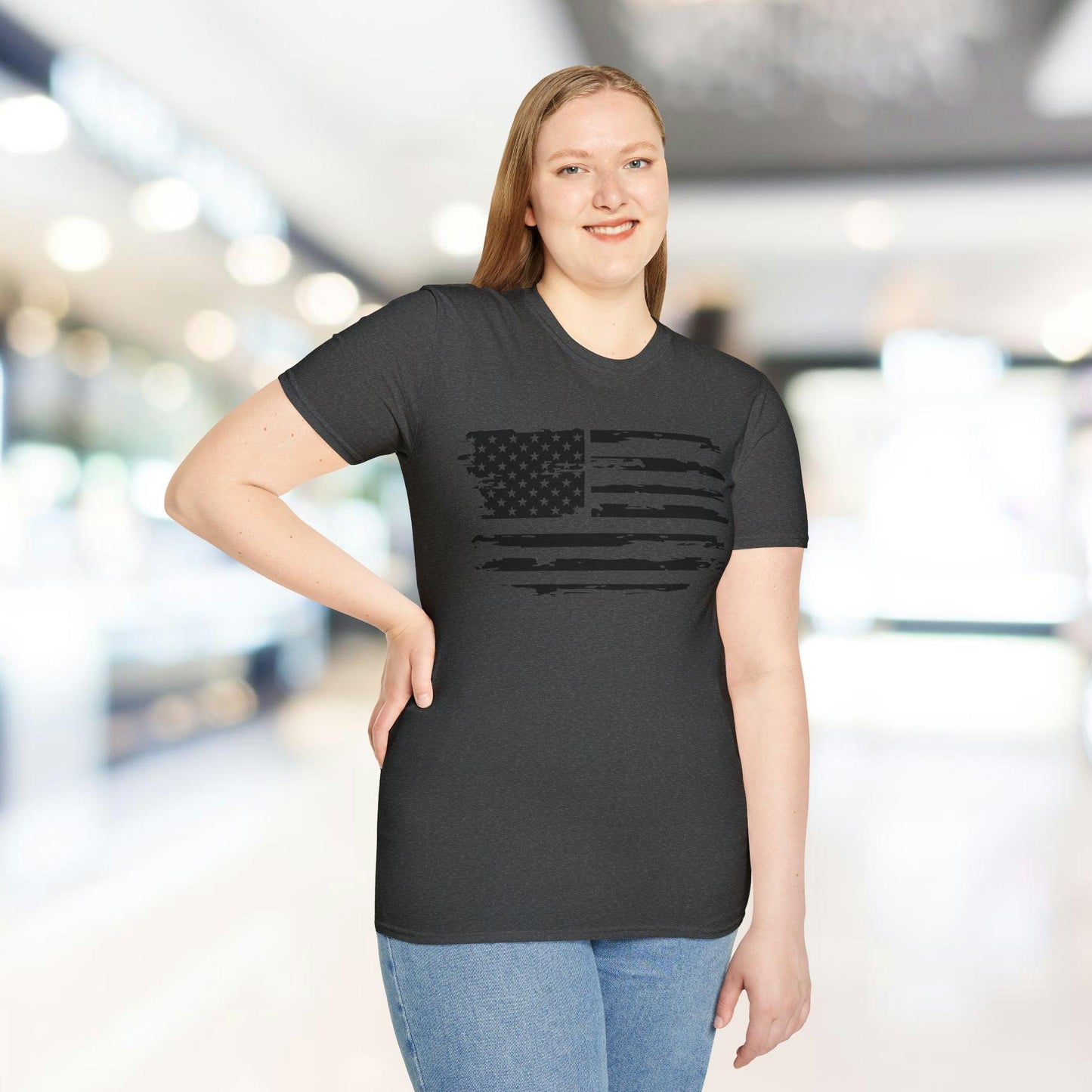 Close-up of distressed black and white American flag print on soft, relaxed-fit T-shirt fabric, highlighting