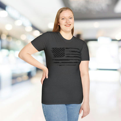 Close-up of distressed black and white American flag print on soft, relaxed-fit T-shirt fabric, highlighting