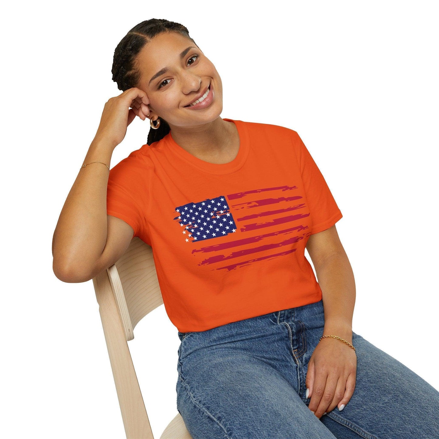 Close-up of the distressed American flag print on the relaxed fit, soft cotton fabric showing faded edges and vibrant colors
