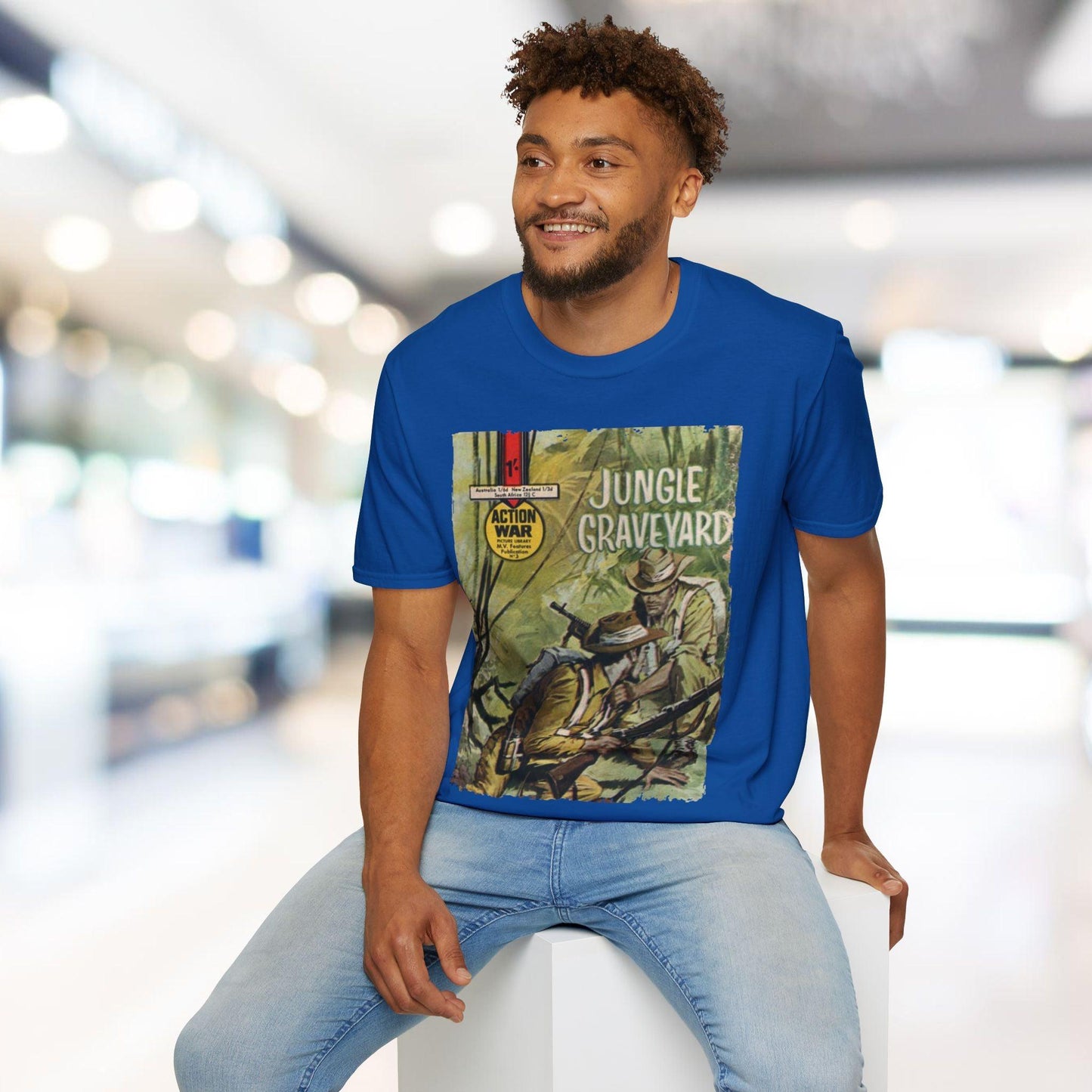 Close-up of the unisex softstyle T-shirt’s vibrant action comic print on the chest, showing detailed artwork and bold color