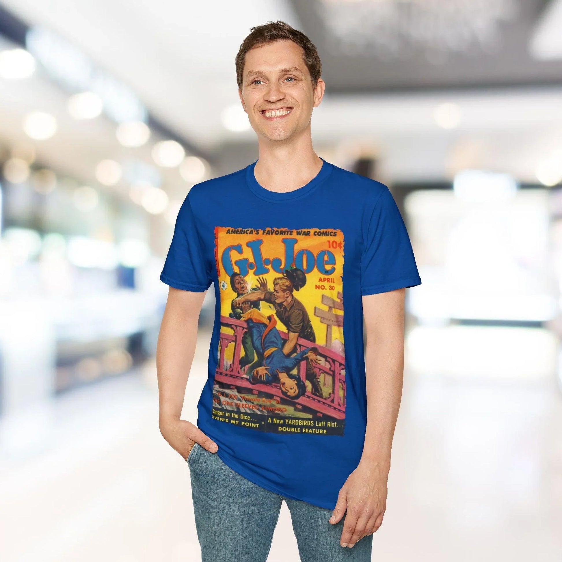 Close-up of the unisex softstyle T-shirt's vibrant red fabric showing smooth texture and subtle heather pattern at the crew