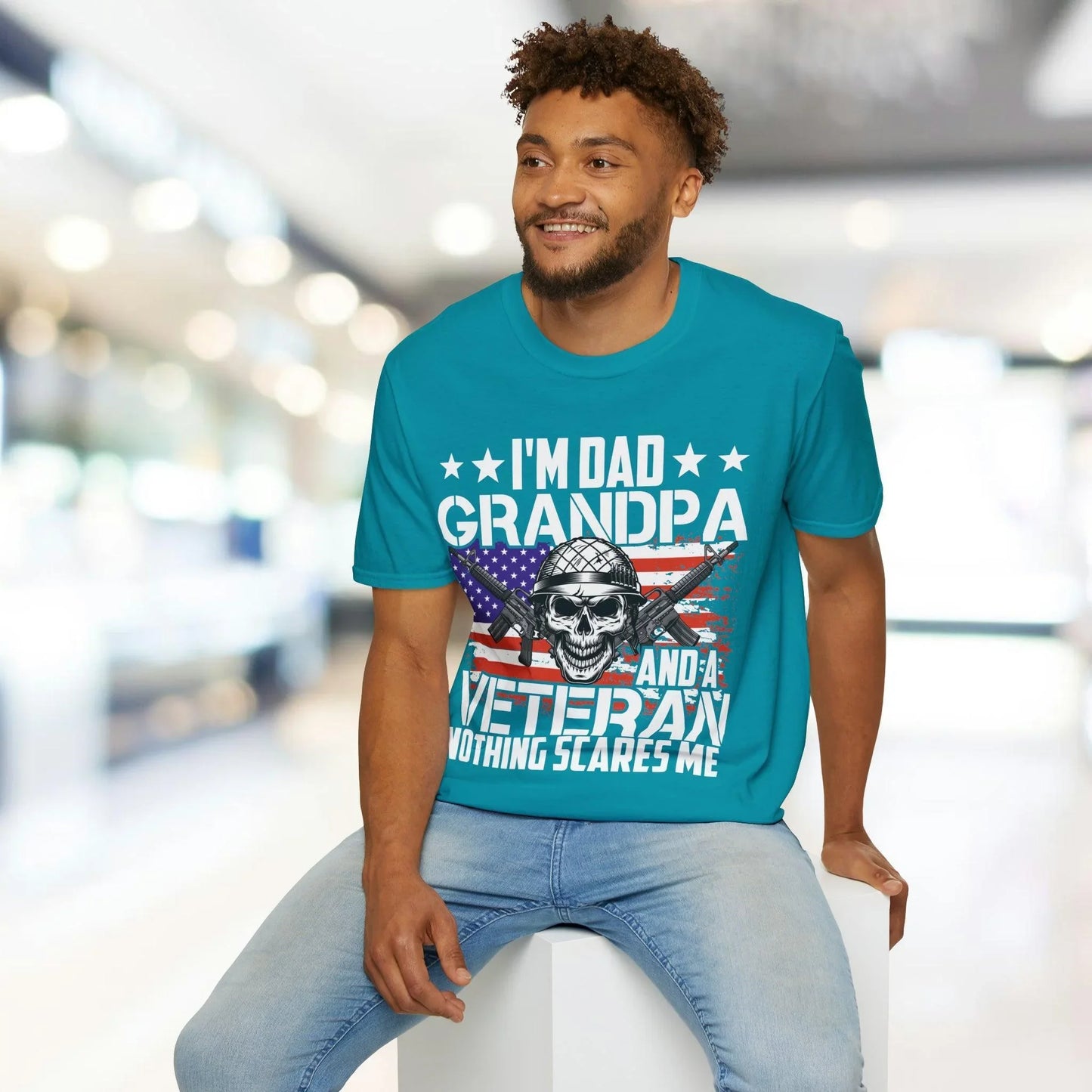 Close-up of the unisex softstyle fabric showing smooth, relaxed fit in charcoal gray with visible crew neckline stitching on