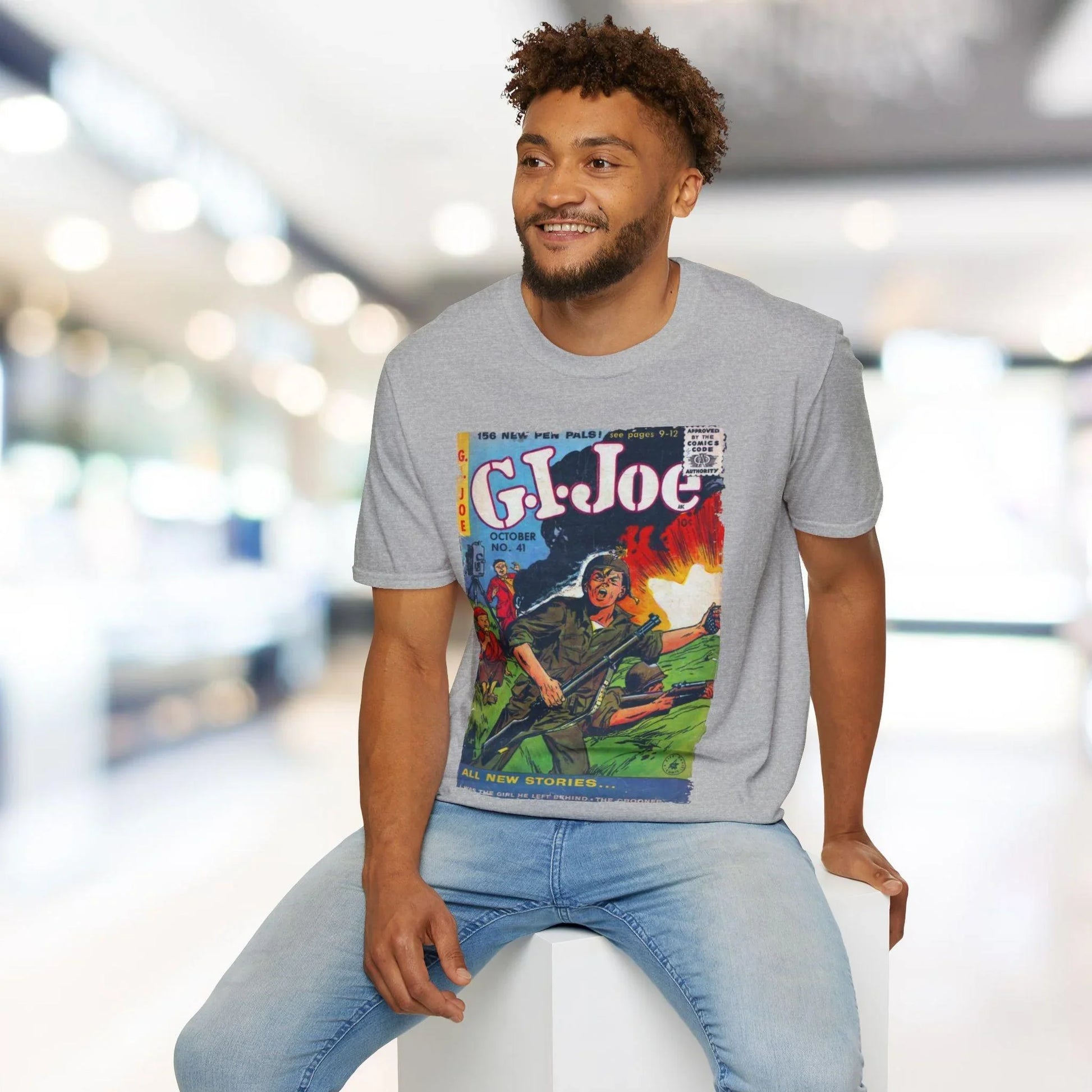 Close-up of the G.I. Joe No.41 softstyle T-shirt’s sewn neckline tag on relaxed-fit navy fabric, highlighting the