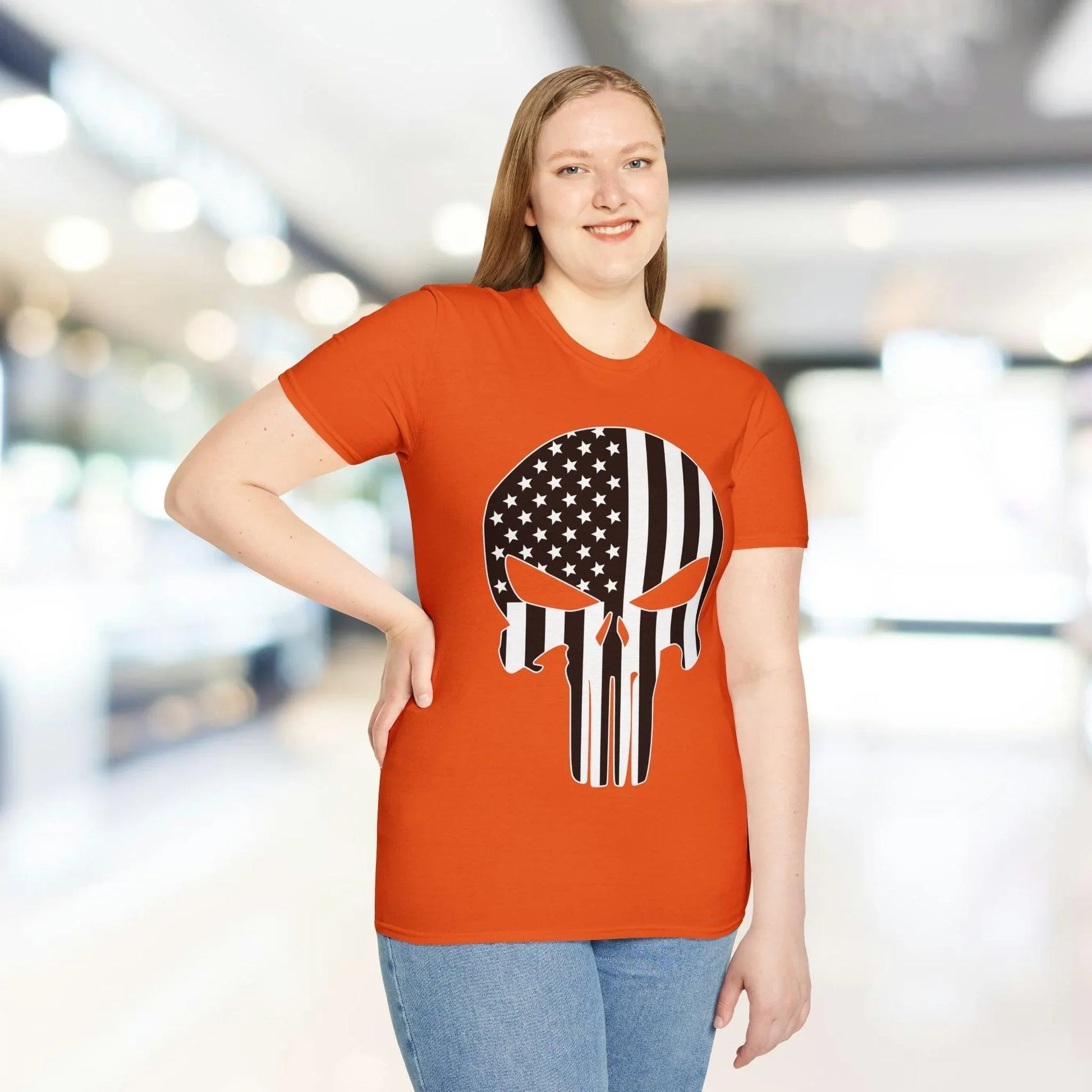 Front neckline and sleeve seam with visible black and white American skull flag graphic on soft white unisex T-shirt