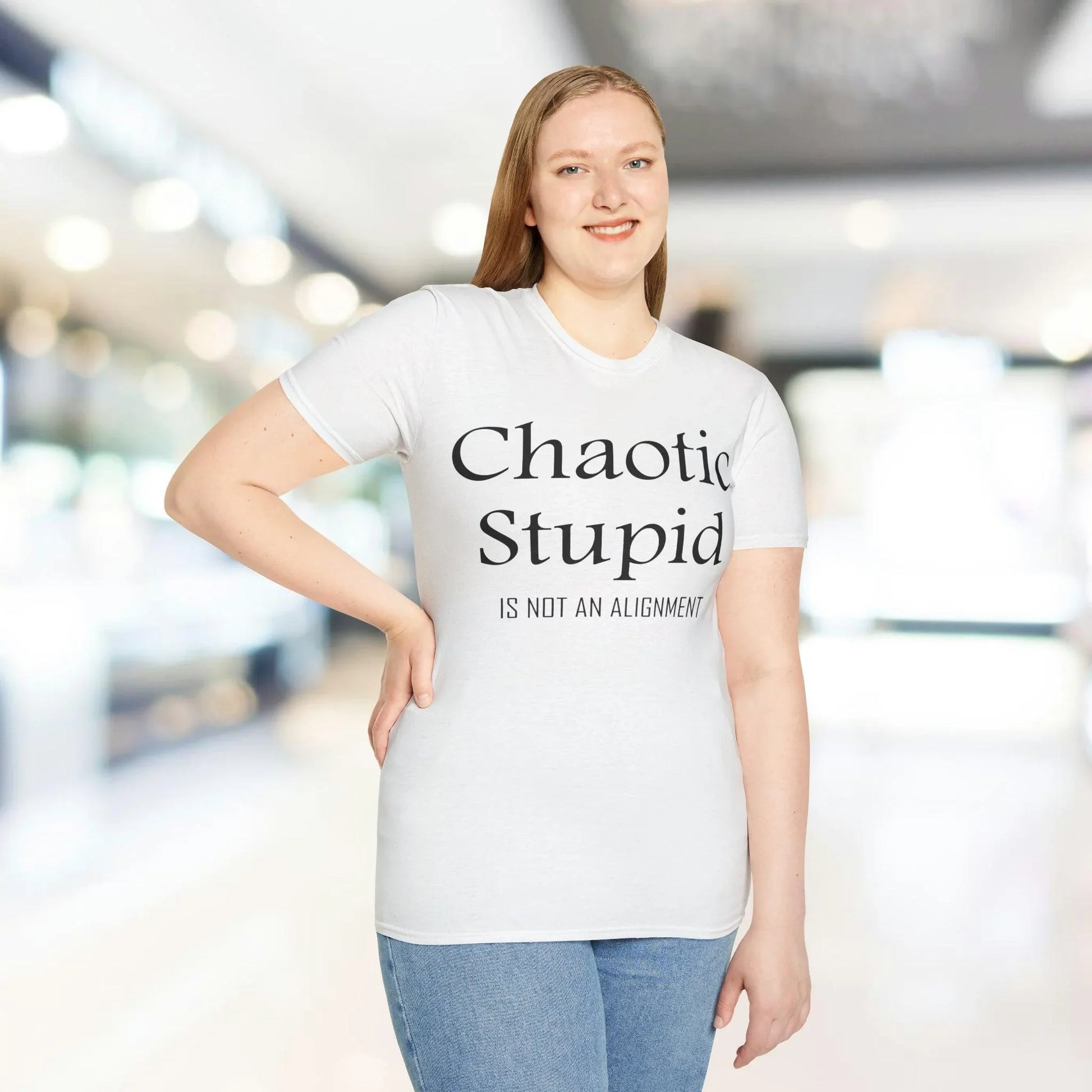 Close-up of black unisex softstyle T-shirt fabric showing smooth texture and subtle stitching detail at the neckline seam.