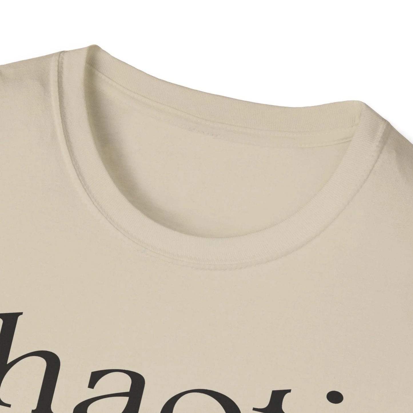 Close-up of the black cotton fabric highlighting the smooth, soft texture and reinforced neckline stitching at the collar