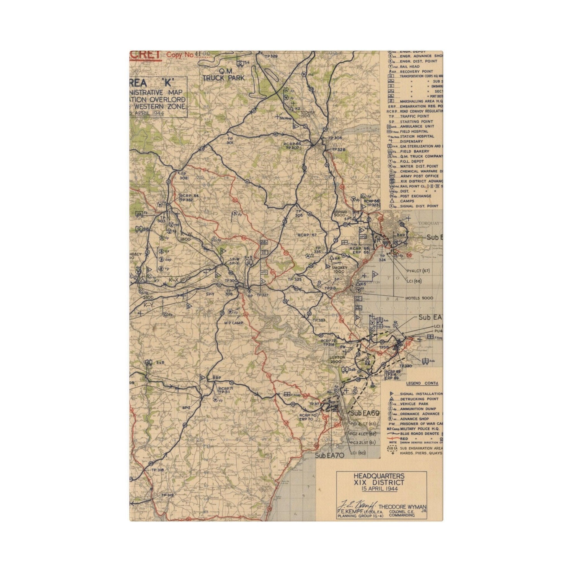 Detail of embossed "Operation Overlord" label on canvas map, showing worn texture and precise hand-stitched edges in