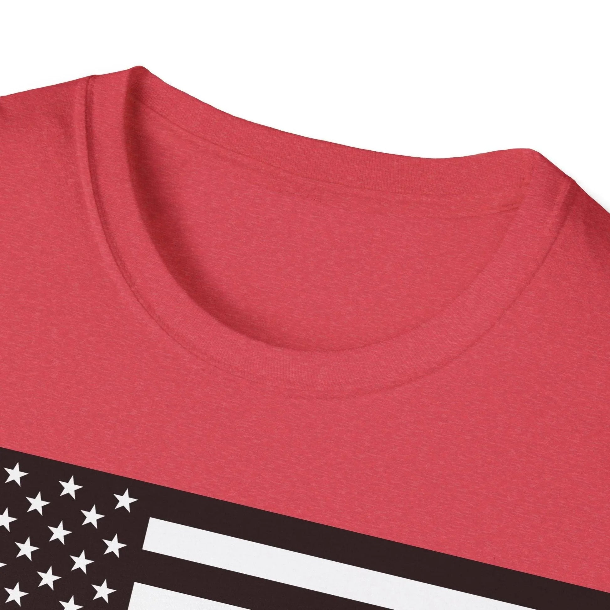 Close-up of the black and white American flag heartbeat graphic on the front chest area of the unisex softstyle T-shirt
