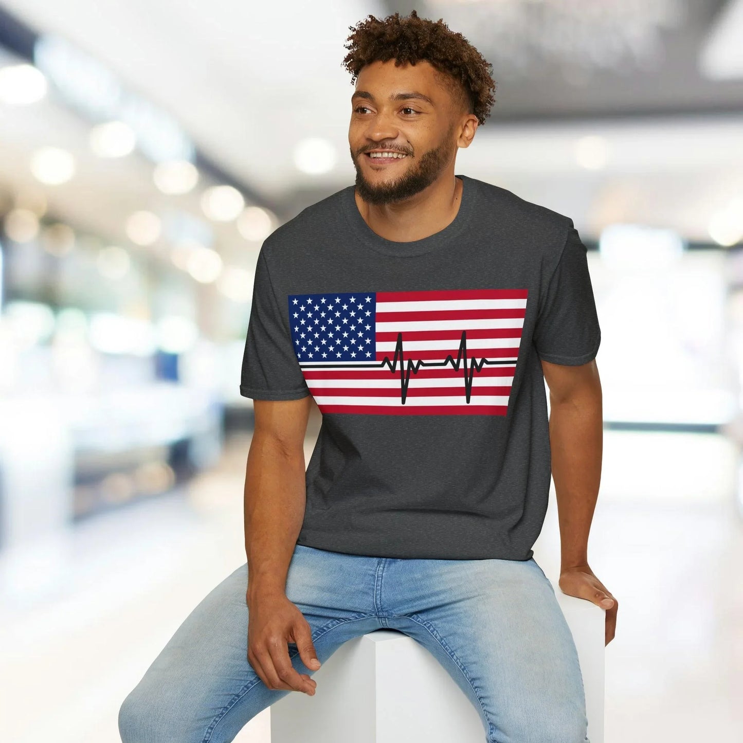 Close-up of the unisex softstyle fabric showing the vibrant red, white, and blue heartbeat design on the American Flag