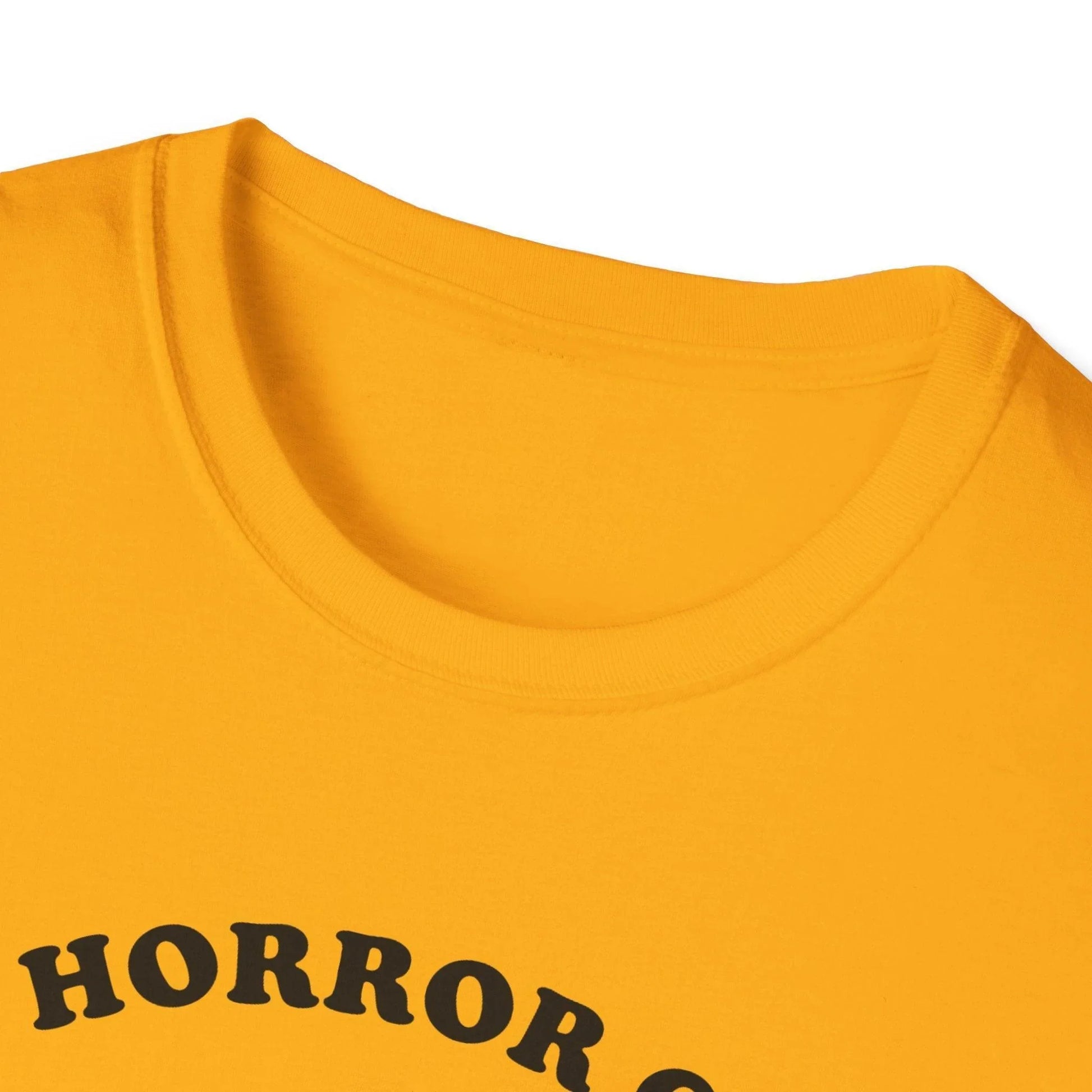 Close-up of the Cosmic Horror Cuteness T-Shirt's vibrant black fabric with a glimpse of the slim fit neckline and stitched