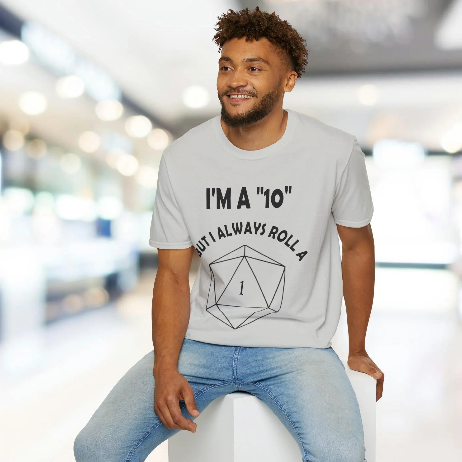 Close-up of the black unisex softstyle T-shirt fabric displaying smooth texture and neatly stitched neckline from a slightly