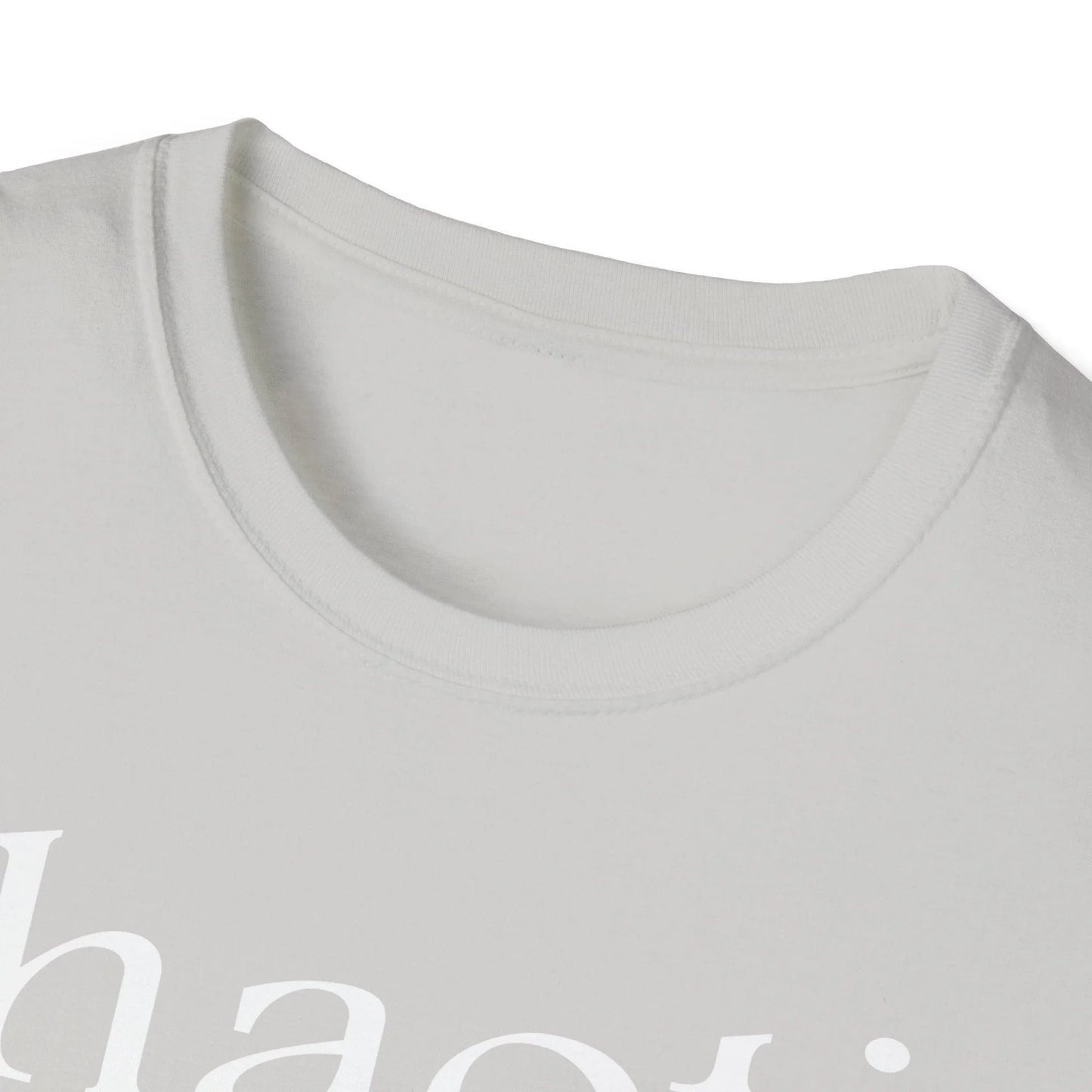 Close-up of the white, unisex relaxed-fit T-shirt fabric emphasizing soft cotton texture and subtle stitching detail at the